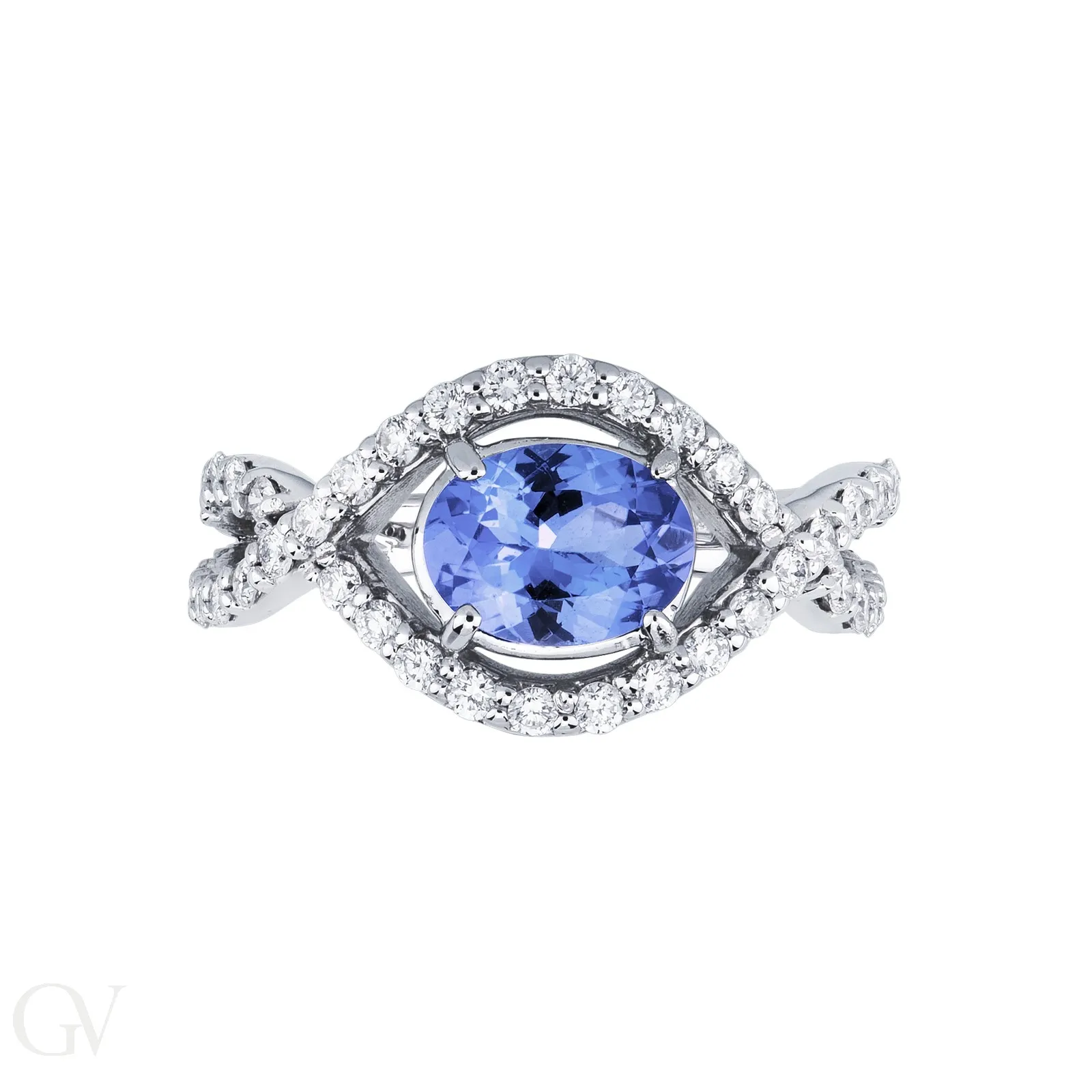 Anello in oro bianco 18k con tanzanite ovale, circa 6x7 mm, e diamanti